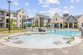 Resort-style pool with tanning ledges